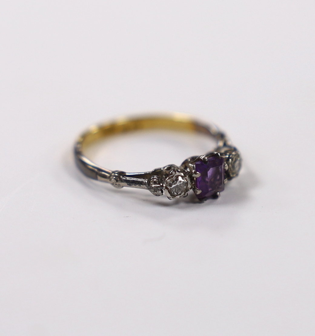 An early 20th century 18ct and plat. single stone amethyst and two stone diamond set ring, size K, gross weight 2.1 grams.